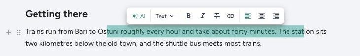 The selection toolbar in the TravelFeed editor, with AI, the block type dropdown, bold, italic, link and alignment
