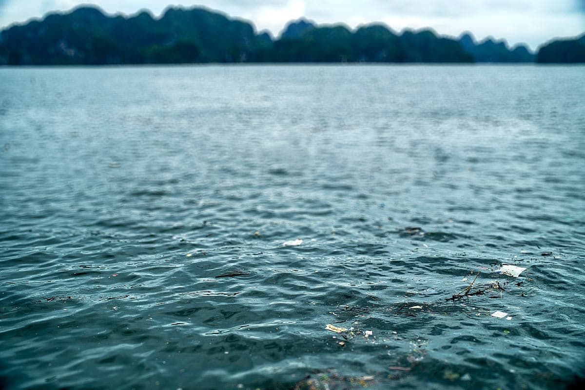 floating rubbish in polluted Halong Bay