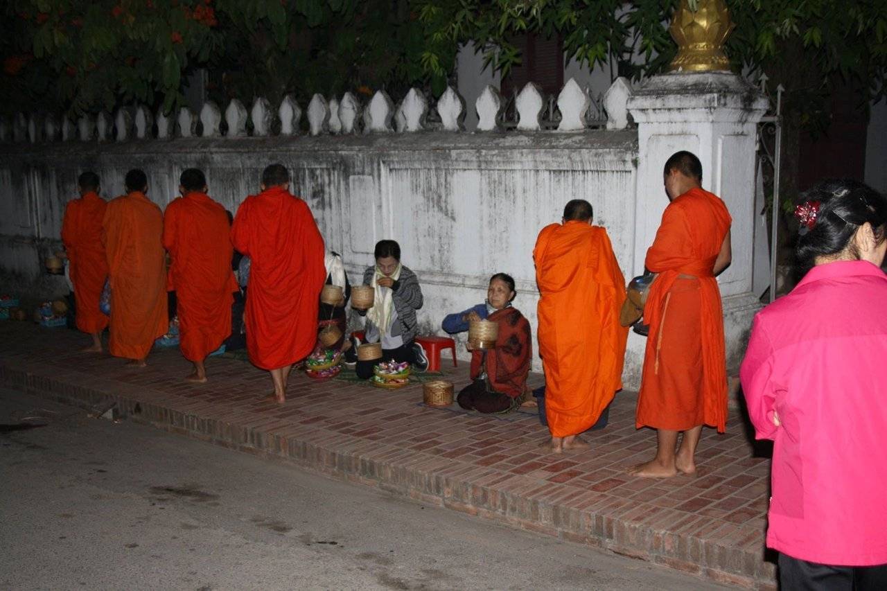 The alms-giving ceremony is a longstanding tradition in Laos Buddhist culture and a sacred ceremony for the locals and the monks.
