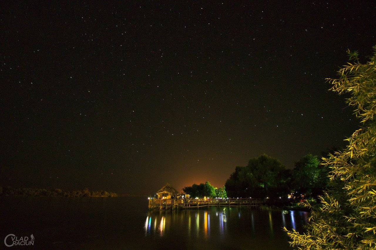 stars above a house on the water in sfantu gheorghe romania