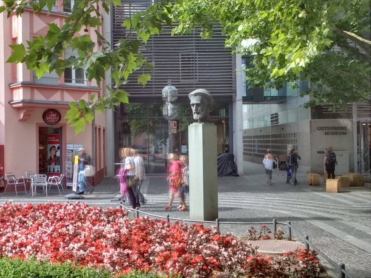 Bust of Johannes Gutenberg with Gutenberg Museum in background