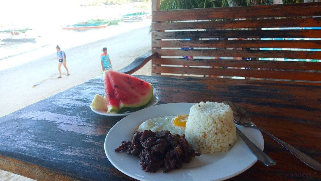 Tapsilog and fruits for breakfast