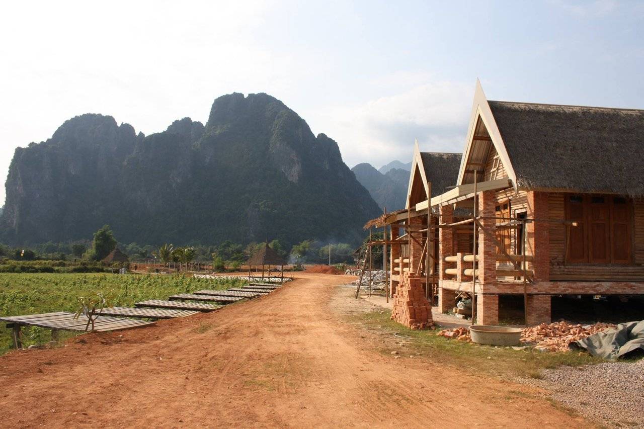 Located about halfway between Vientiane and Luang Prabang is Vang Vieng, a small town on the Nam Song river surrounded by karst limestone mountains.