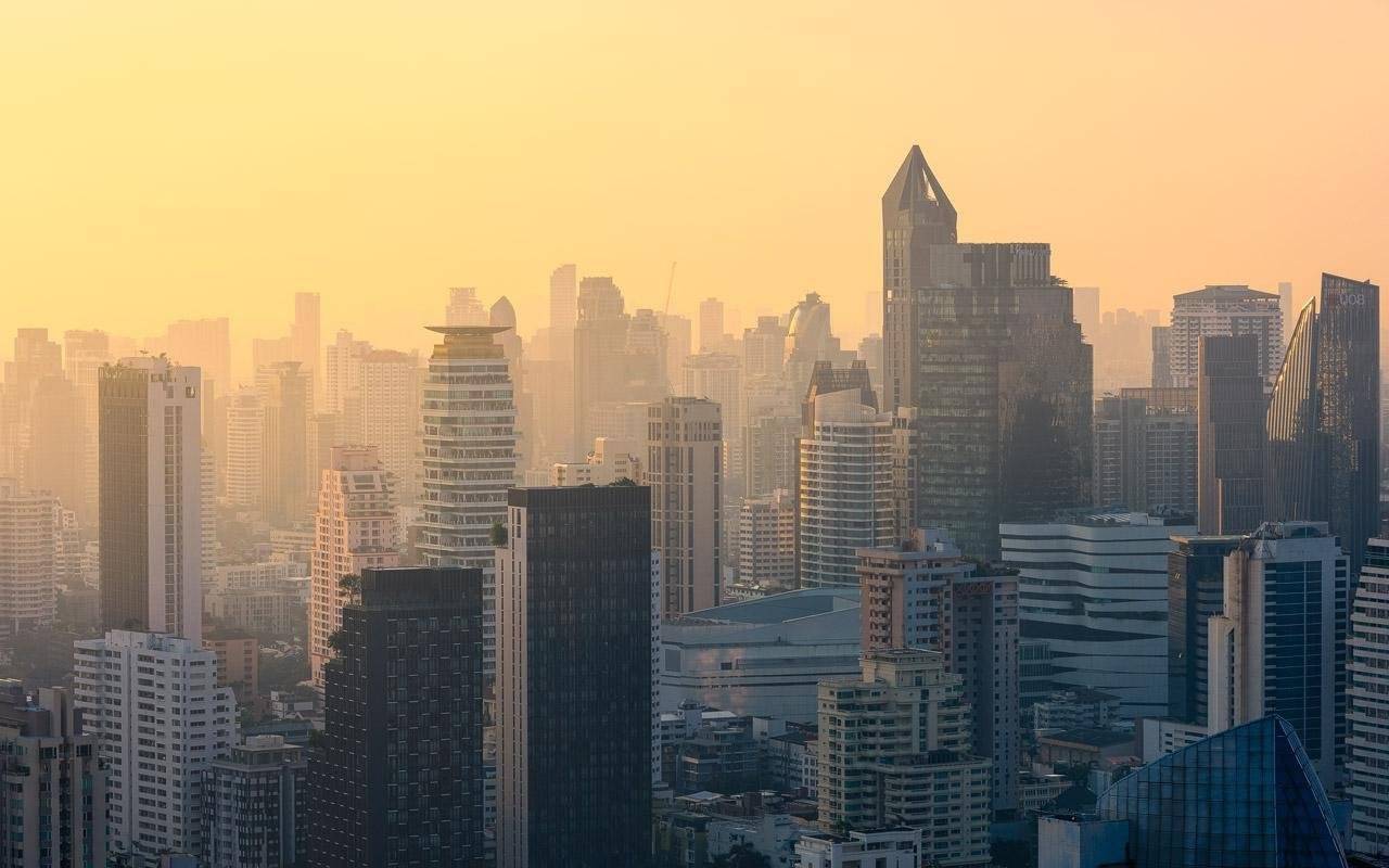 View of Bangkok's skyline during a golden sunrise