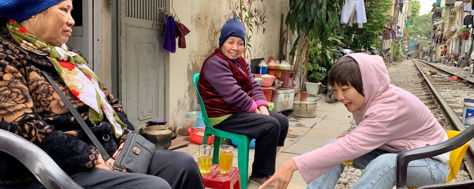 Tea with the locals and helping the community - Train Street, Hanoi, Vietnam