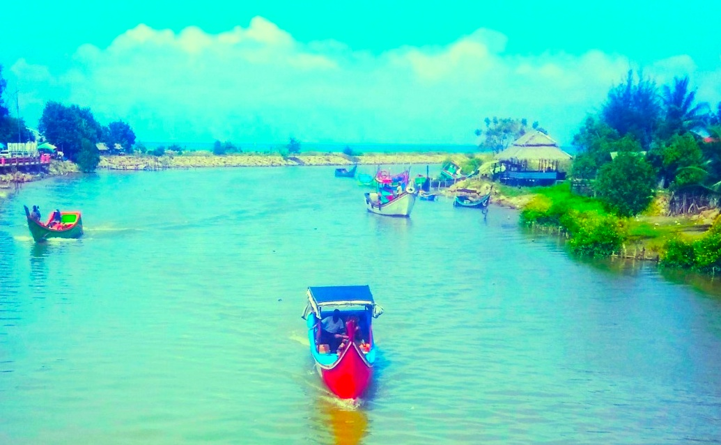Enchantment of the Beauty of Pelangi Beach, Small Boat and Fisherman. Sigli, Aceh Indonesia.