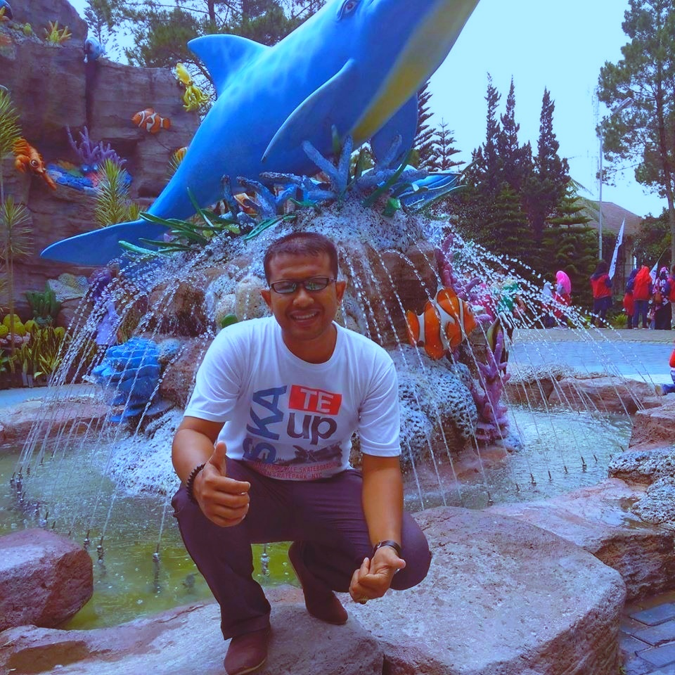 My Photo is Right Right in front of the fish ... Raw fish what its name is, but some say it is a dolphin. (The Atlantis)