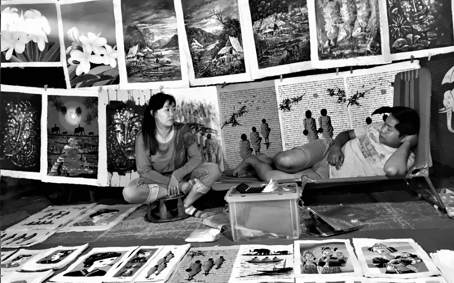 Local selling painting at night market 