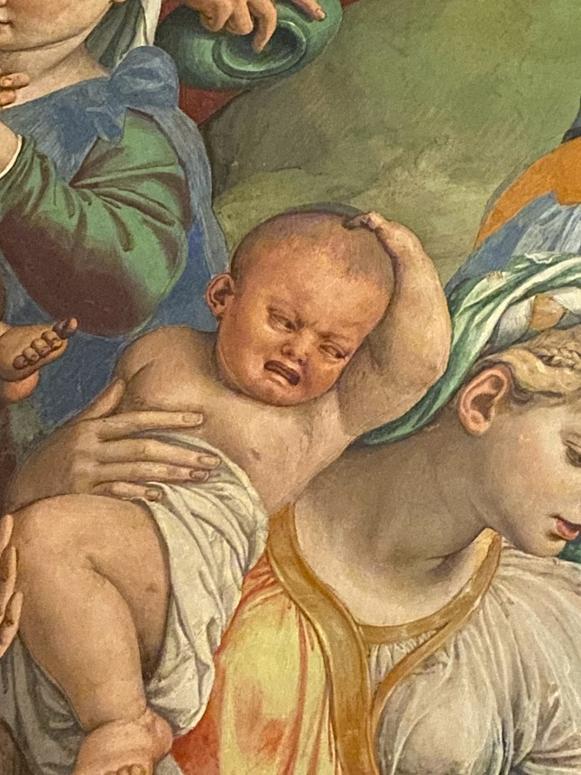 A very disgruntled-looking baby painted in some royal person’s bedroom