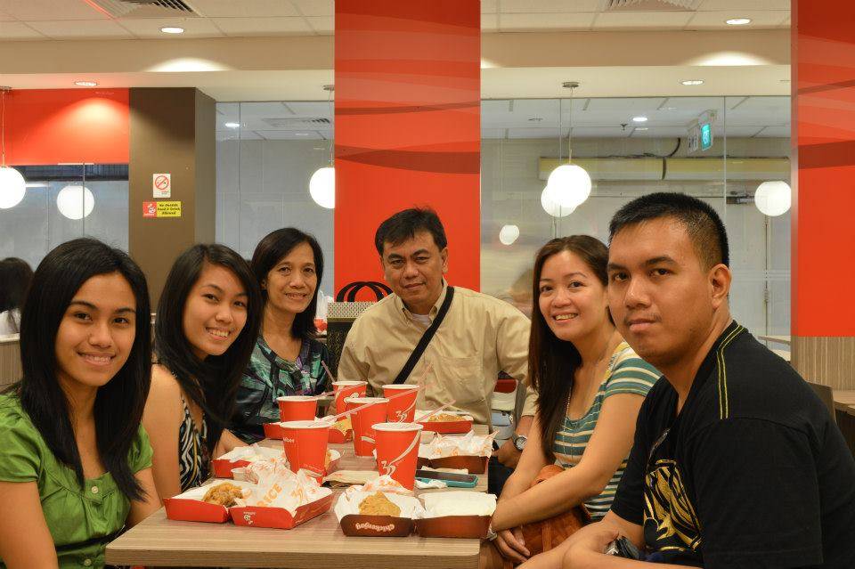 Eating inside a Jollibee restaurant in Lucky Plaza mall