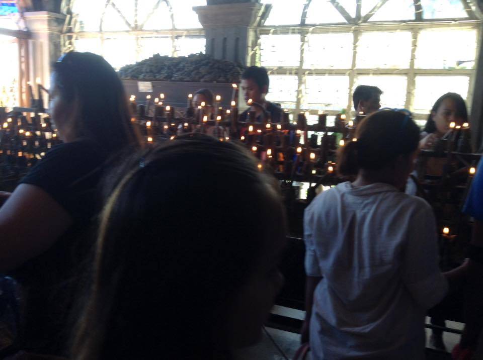 People lighting the candles inside the Simala Shrine
