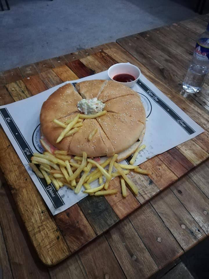 Giant hamburger with fries (sliced into 8 pieces)
