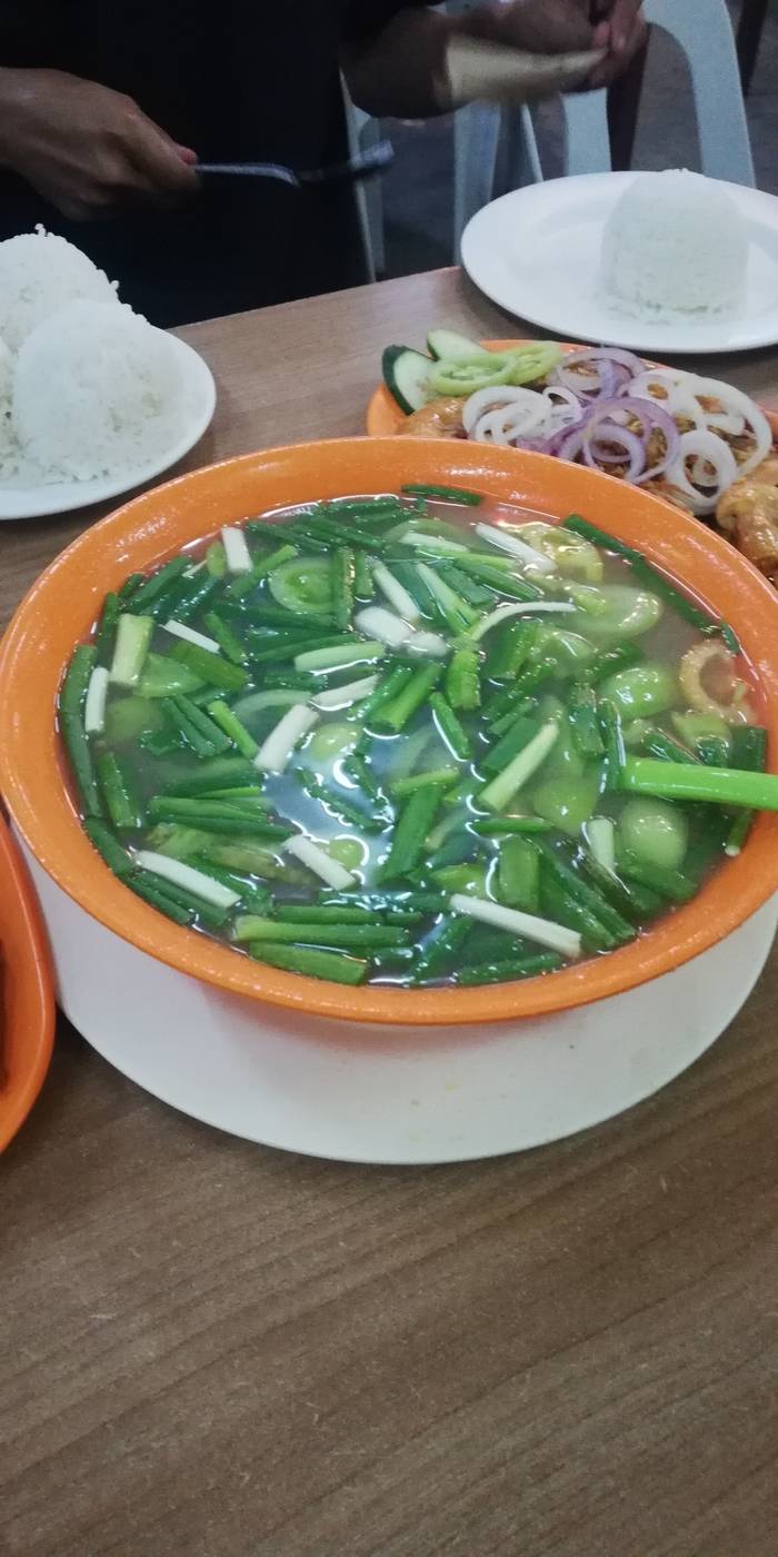 Tinola soup with tomatoes, string beans and other veggies