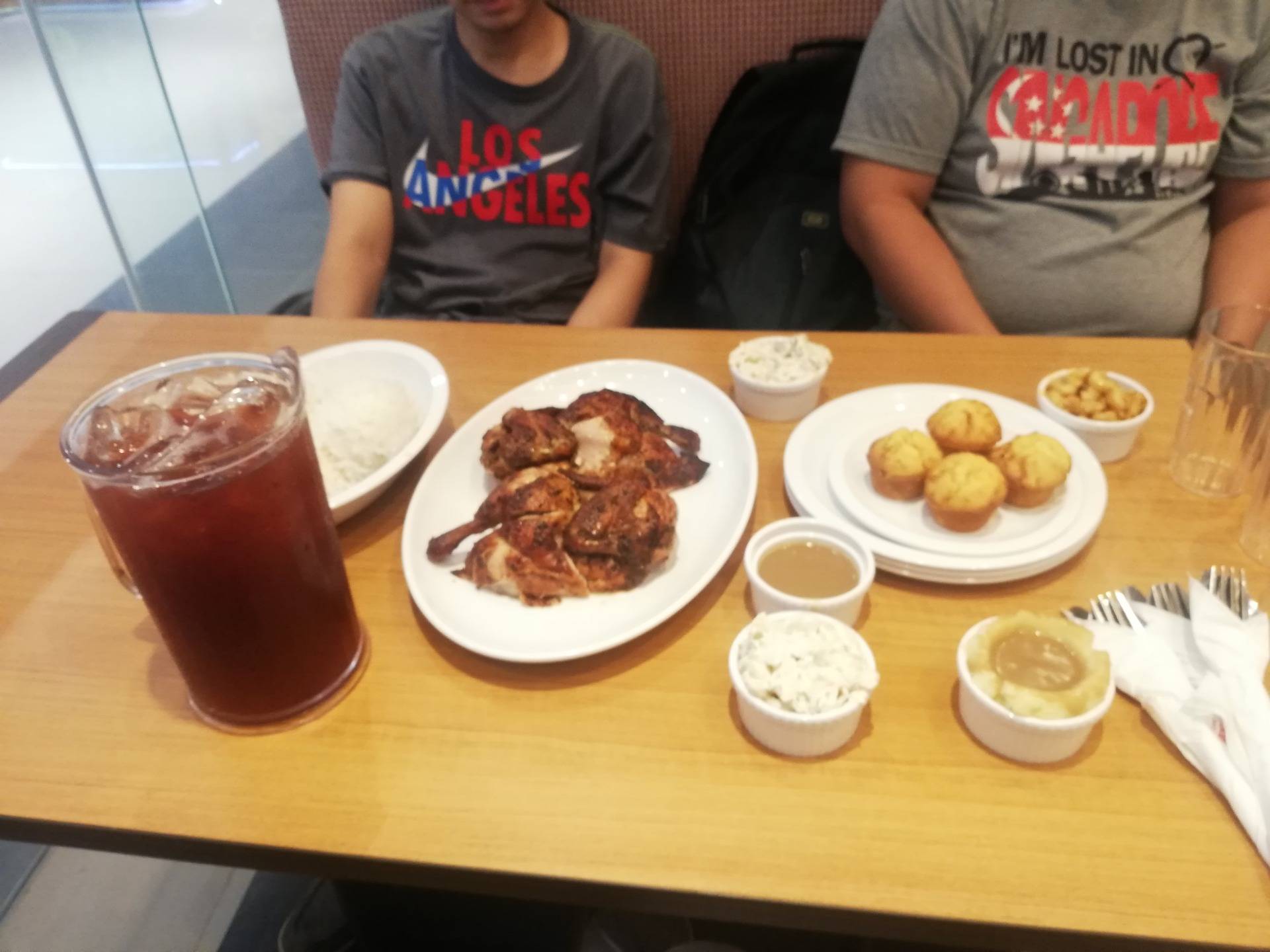 Fried chicken with rice platter, muffins, side dishes, gravy and 1 pitcher of iced tea