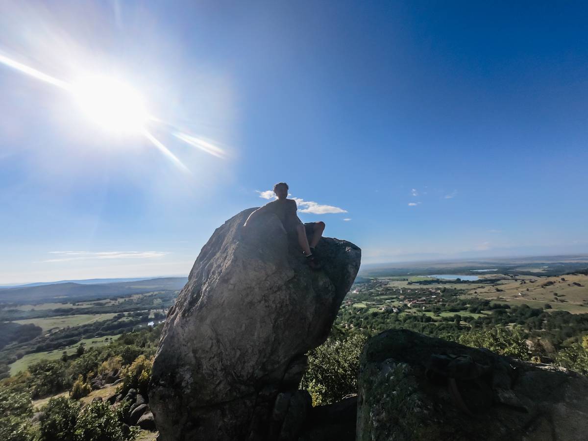 A friend climbed on top of one of the rocks