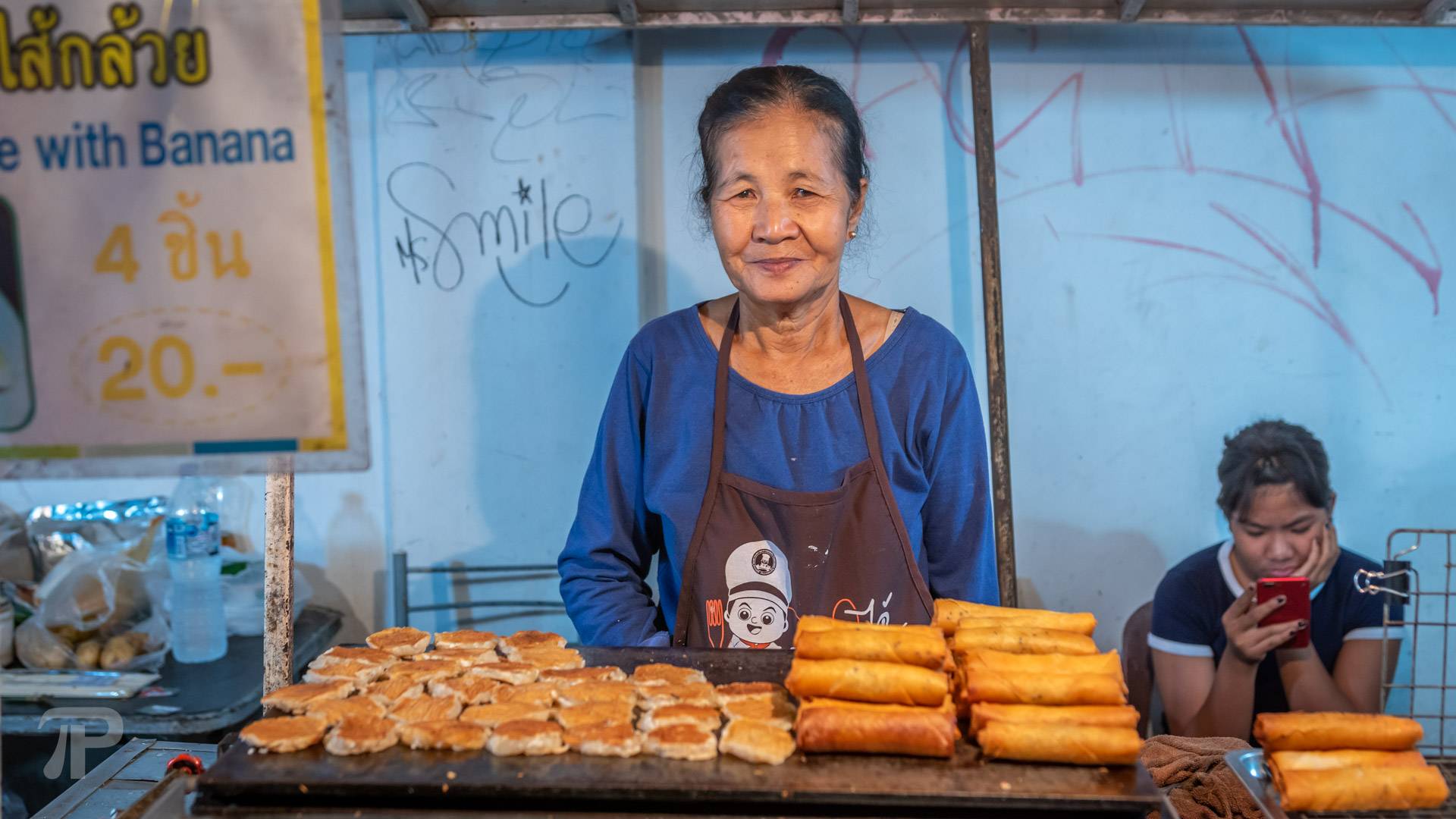 Nice local vendor selling pancakes and fried spring rolls for 10 Baht
