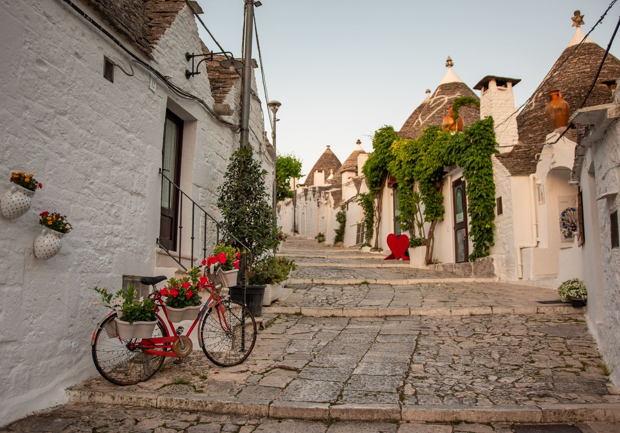 Trulli home on the left. Very central and one of the most photographed trulli