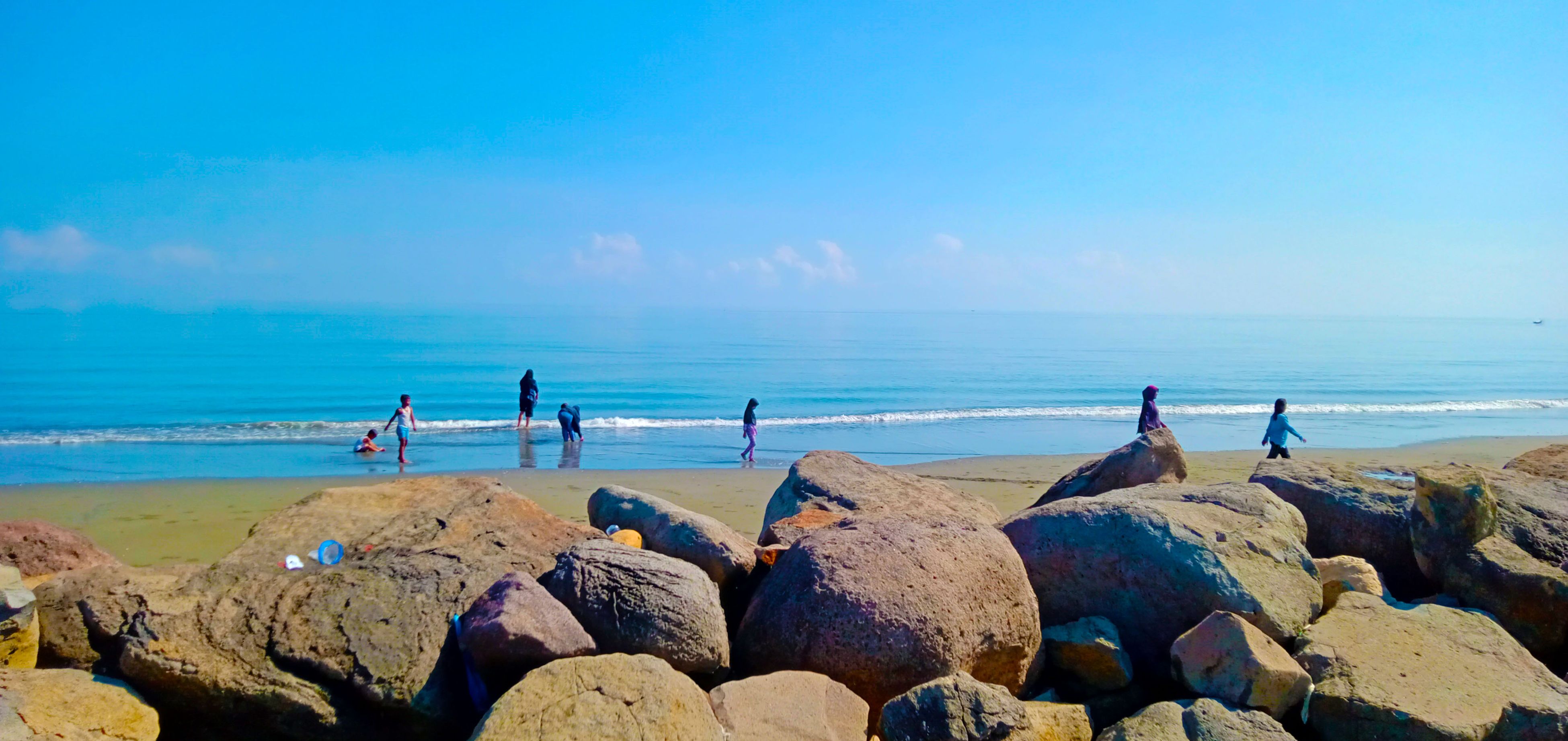               You can see the rocks on the beach.