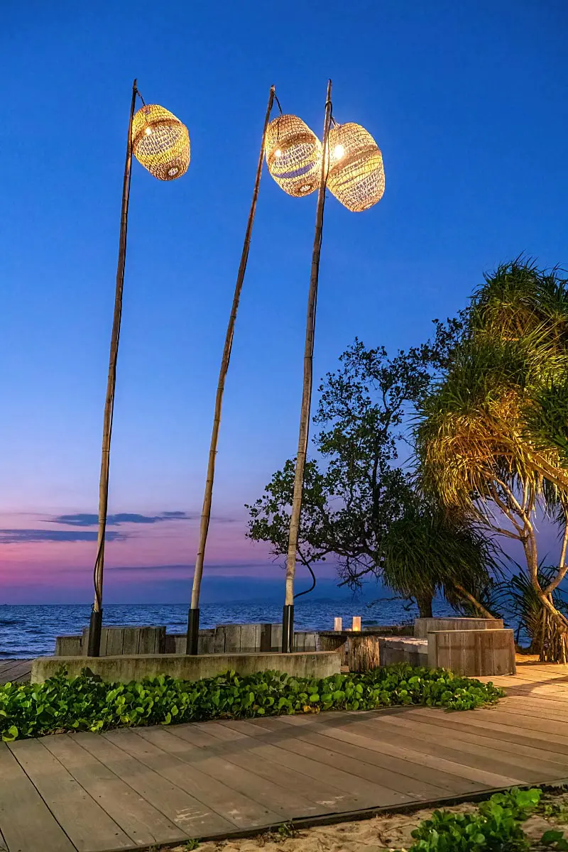 Upcycled traditional fishing gear is the perfect lamp next to the renovated fishing house.