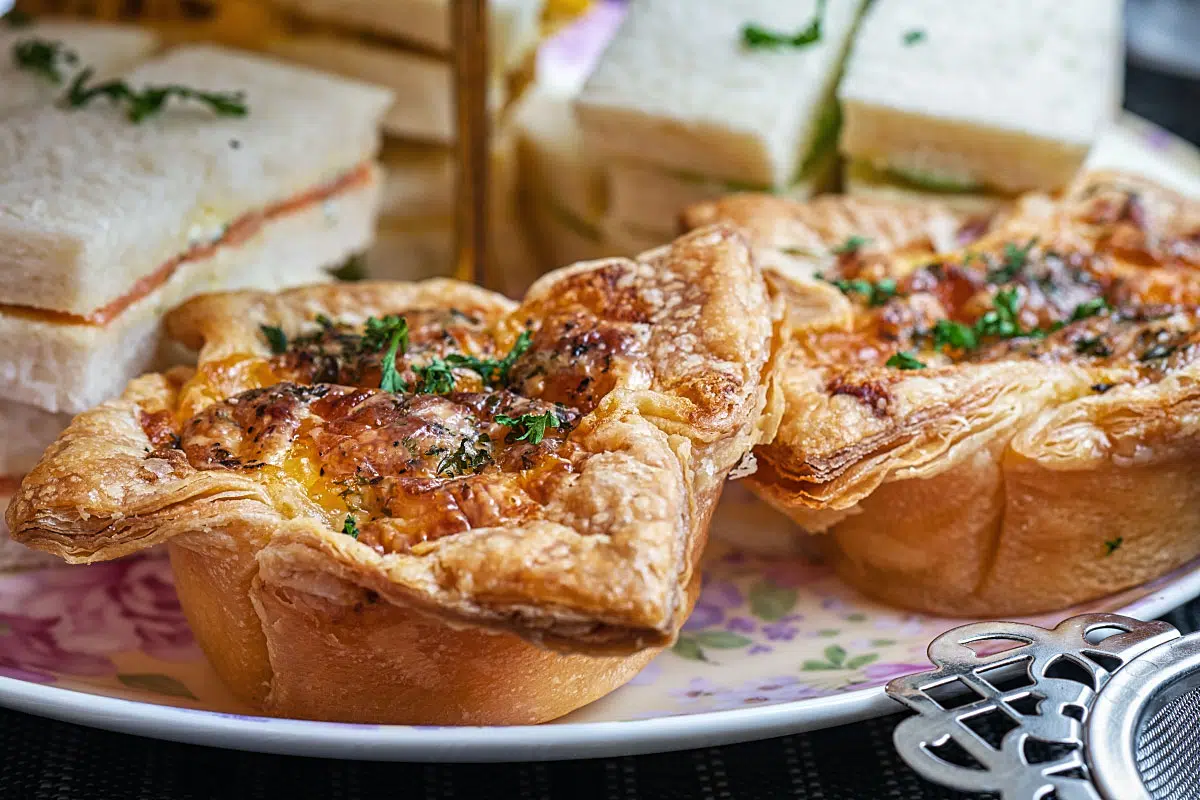 Savouries: Smoked salmon & herb cream cheese sandwich, Mango & curried chicken sandwich, Cucumber sandwich, and salmon quiche.