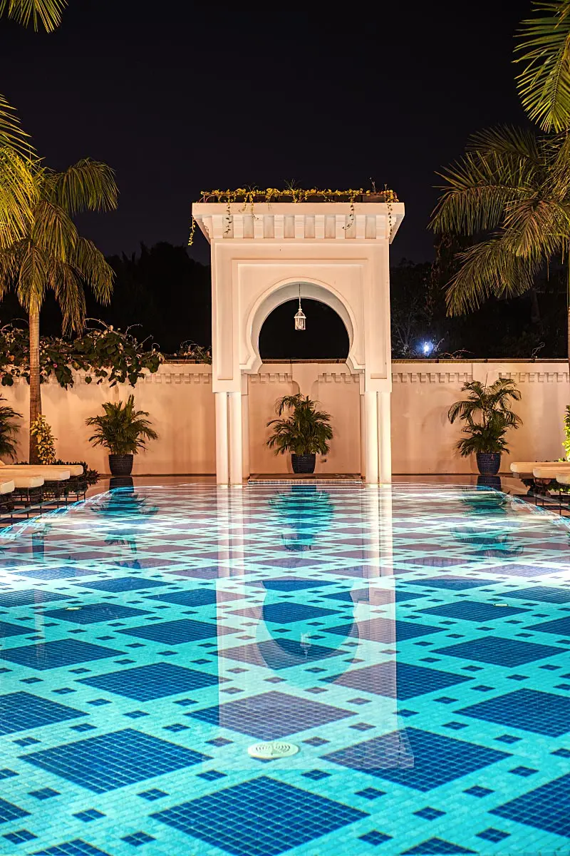 A pool in the heart of Sarai Resort cools the air in the courtyard.