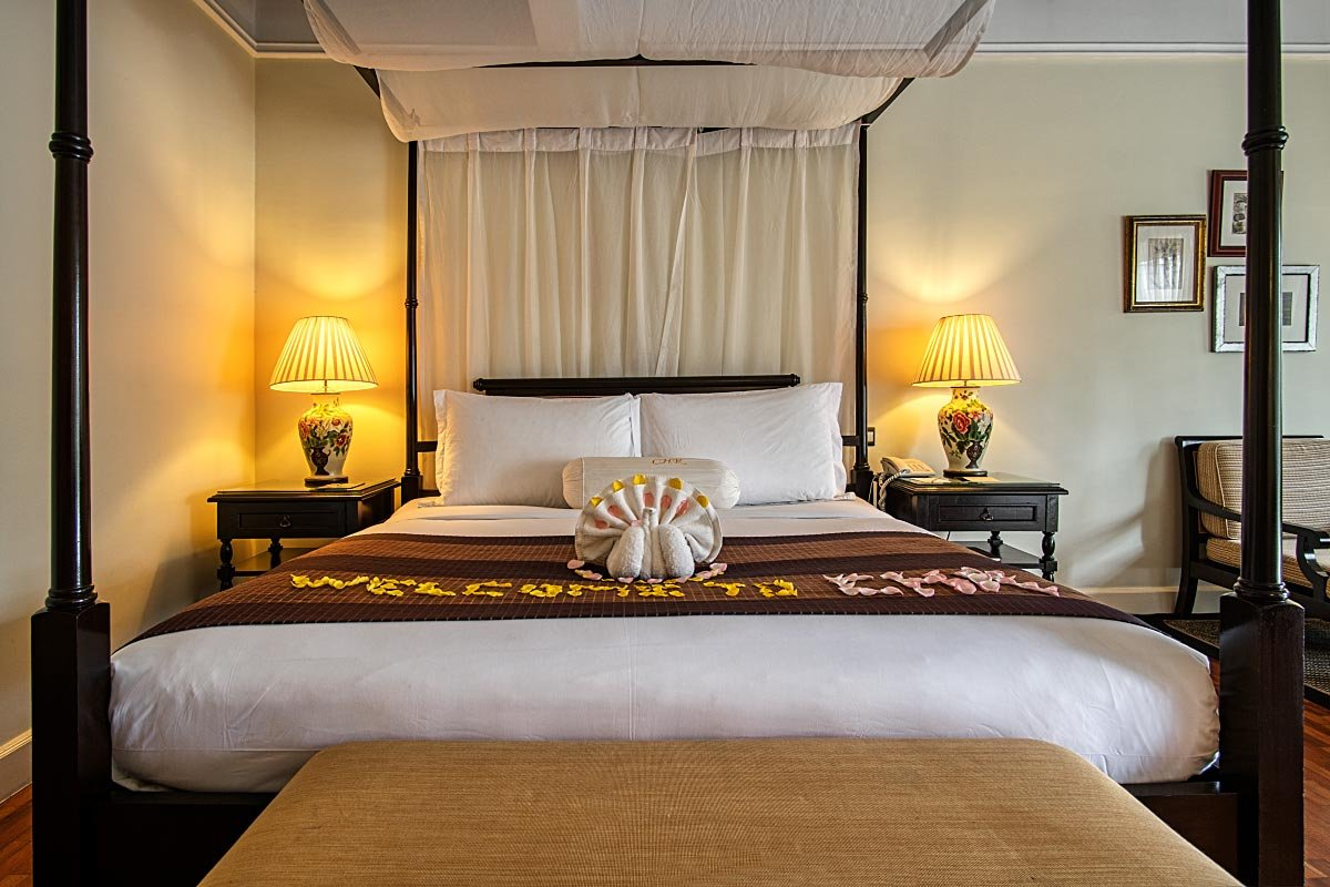 An antique canopy bed offers maximum comfort.