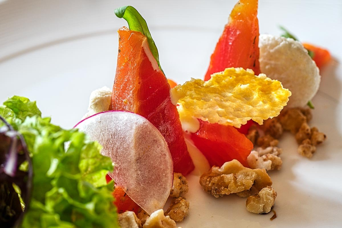 Cured citron ocean trout with walnuts and honey mustard dressing.