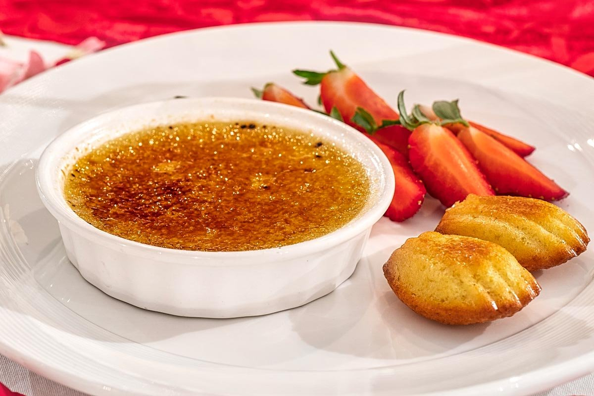 Chrysanthemum infused creme brulee with honeyed madeleine and fresh strawberries.
