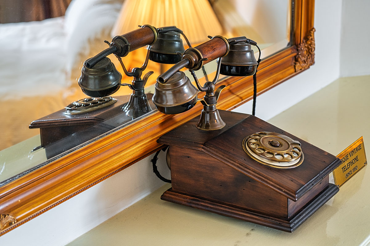 The vintage telephone in the room looks great and is a useful tool.
