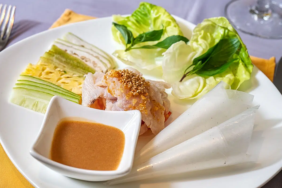 DIY spring rolls focused on meticulously seasoned sea bass salad.