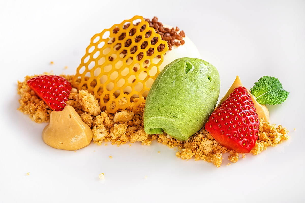 White chocolate mousse with strawberries, lemon basil sorbet, and almond crumble.