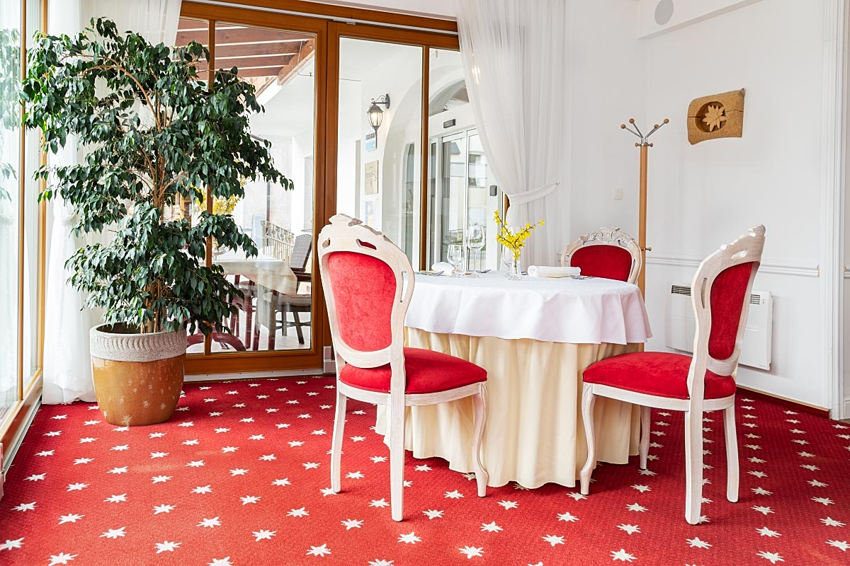 Edelweiss flowers on the red carpet are a subtle nod to the nearby mountains.