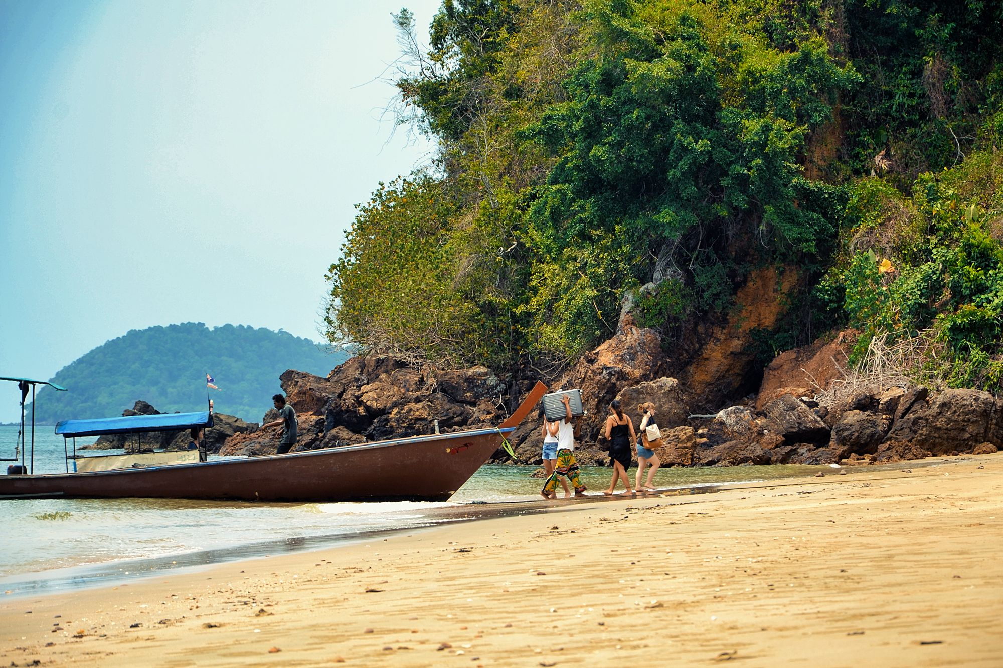 To get to Koh Jum, the boat stops at the sea, and a smaller boat, usually provided by your host, picks you up.