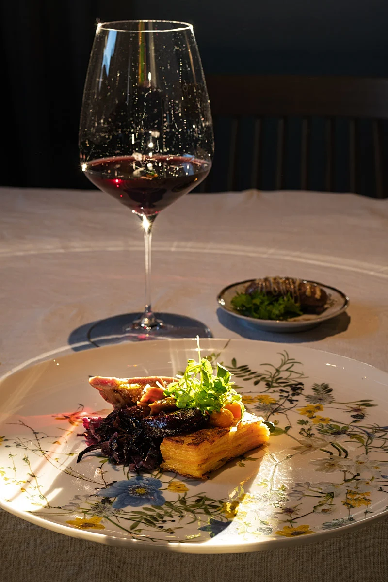 Lamb was presented in three ways: stacked potatoes, red cabbage