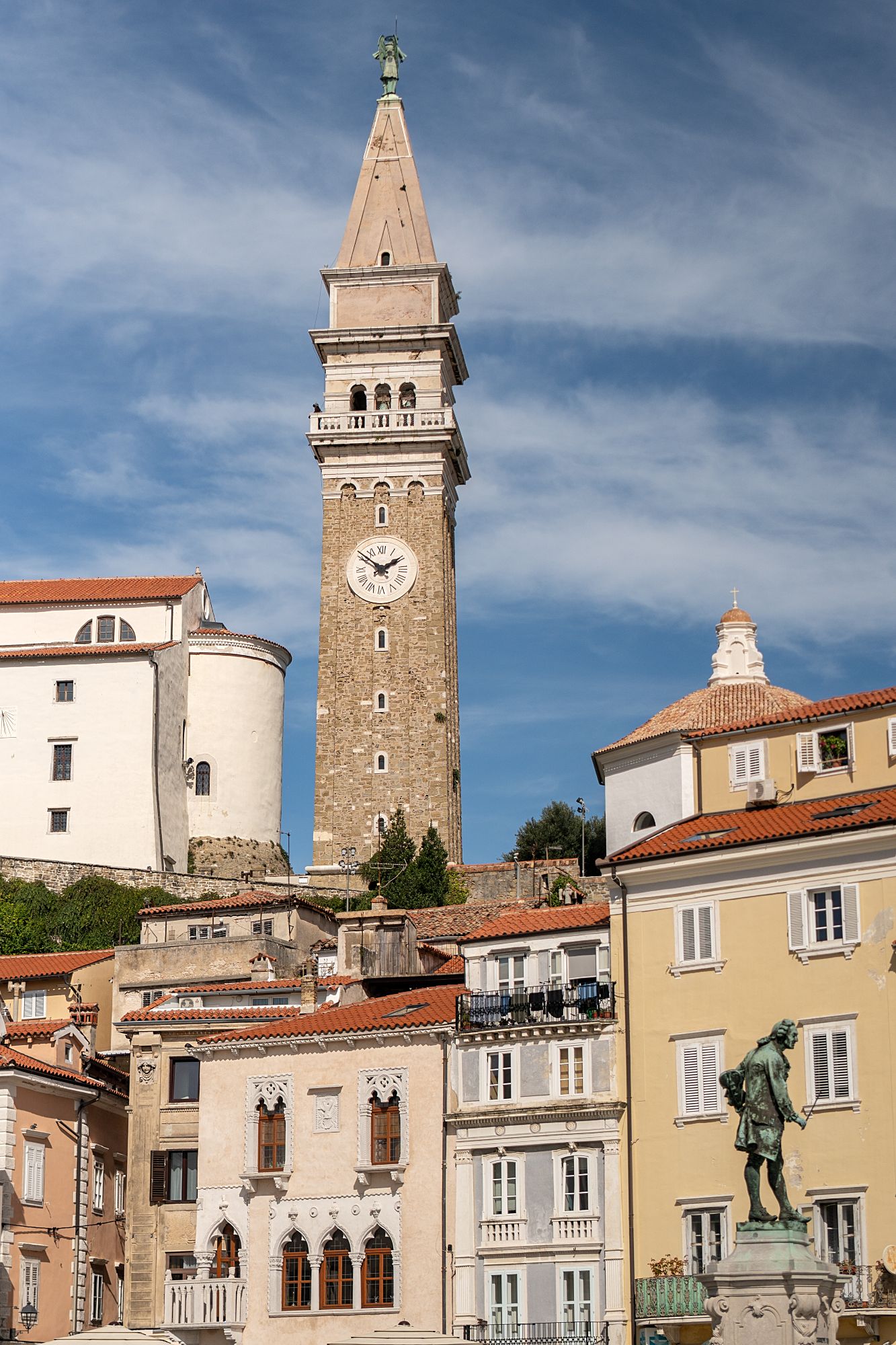 Time in Piran is visible. On the clock. On the walls. On the edges of buildings where the plaster gave up decades ago.