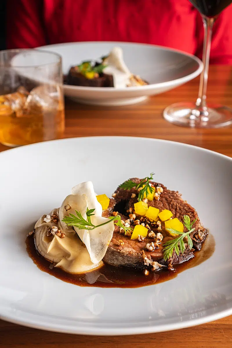 Succulent slow-cooked beef, celeriac puree seasoned with caramel butter and chocolate jus