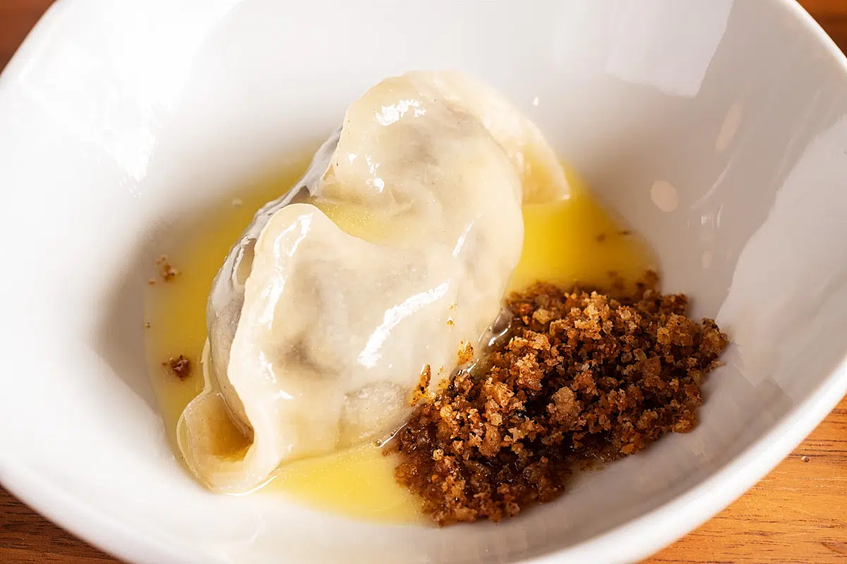 Tepka pear dumpling with sourdough crumble and butter sauce