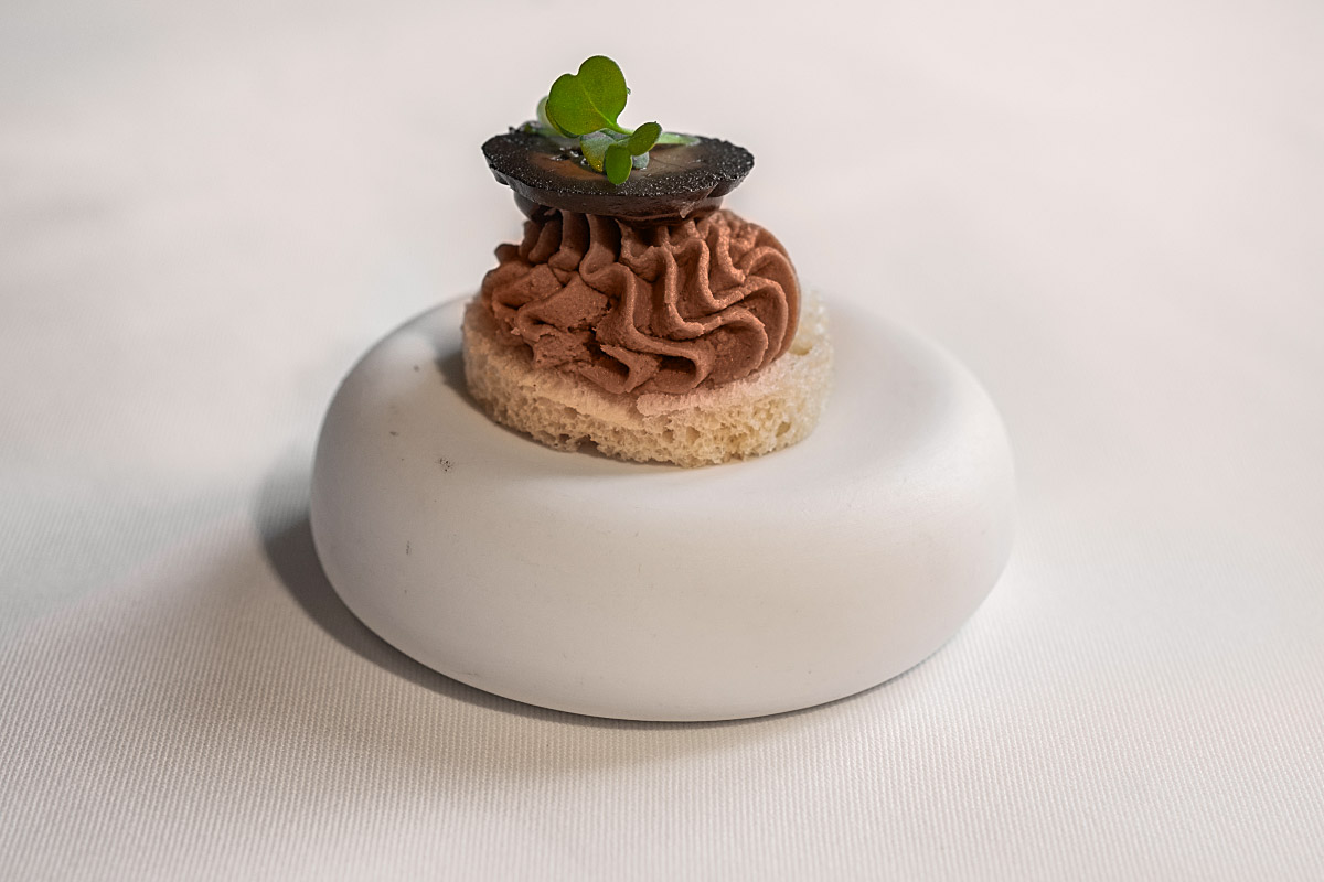 Game pâté on brioche gained balance from Port wine gel and roasted black walnut.