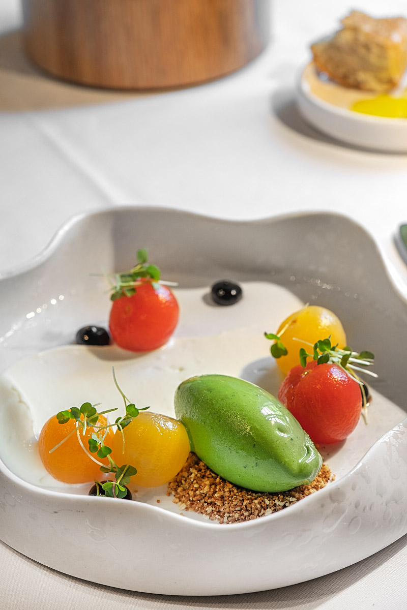 The striking Castle Caprese combined pickled tomatoes, mozzarella mousse and vividly green basil ice cream.