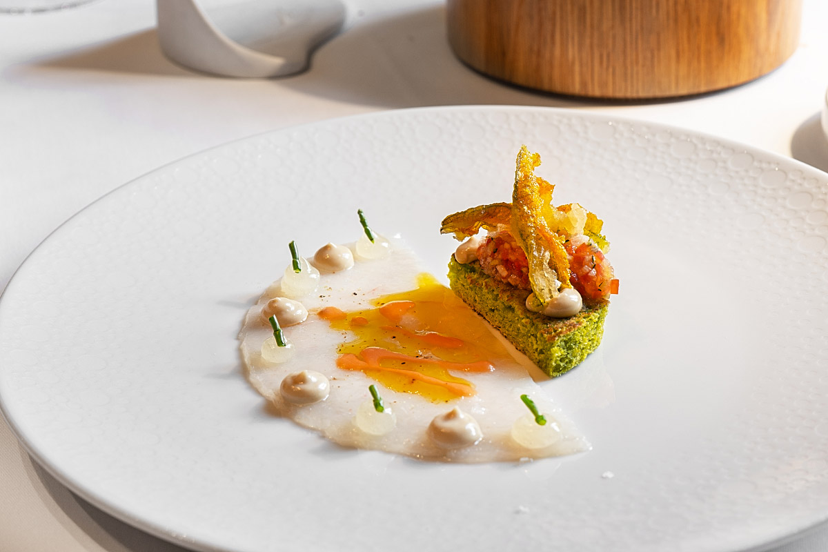 Delicate prawn carpaccio was paired with spinach brioche, citrus gel, anchovy mayonnaise and fried pumpkin blossom.