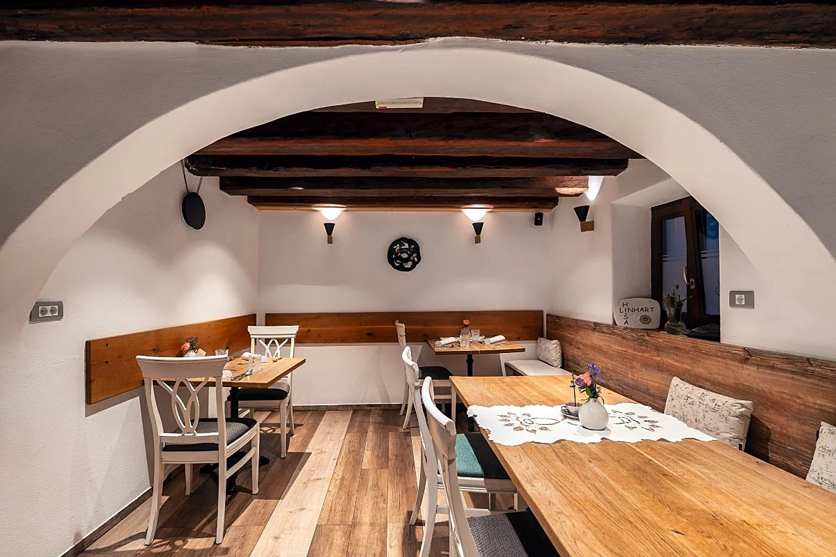 A second dining room has timber beams and a quieter, more domestic scale.