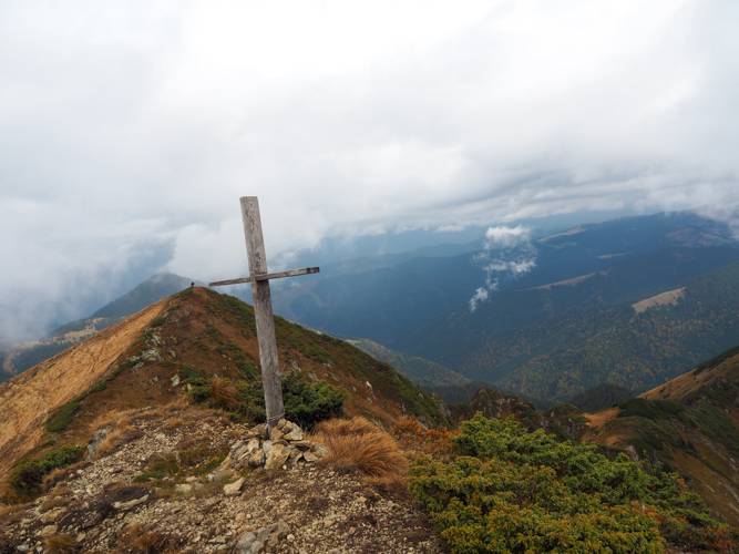 Cross on top of mountain