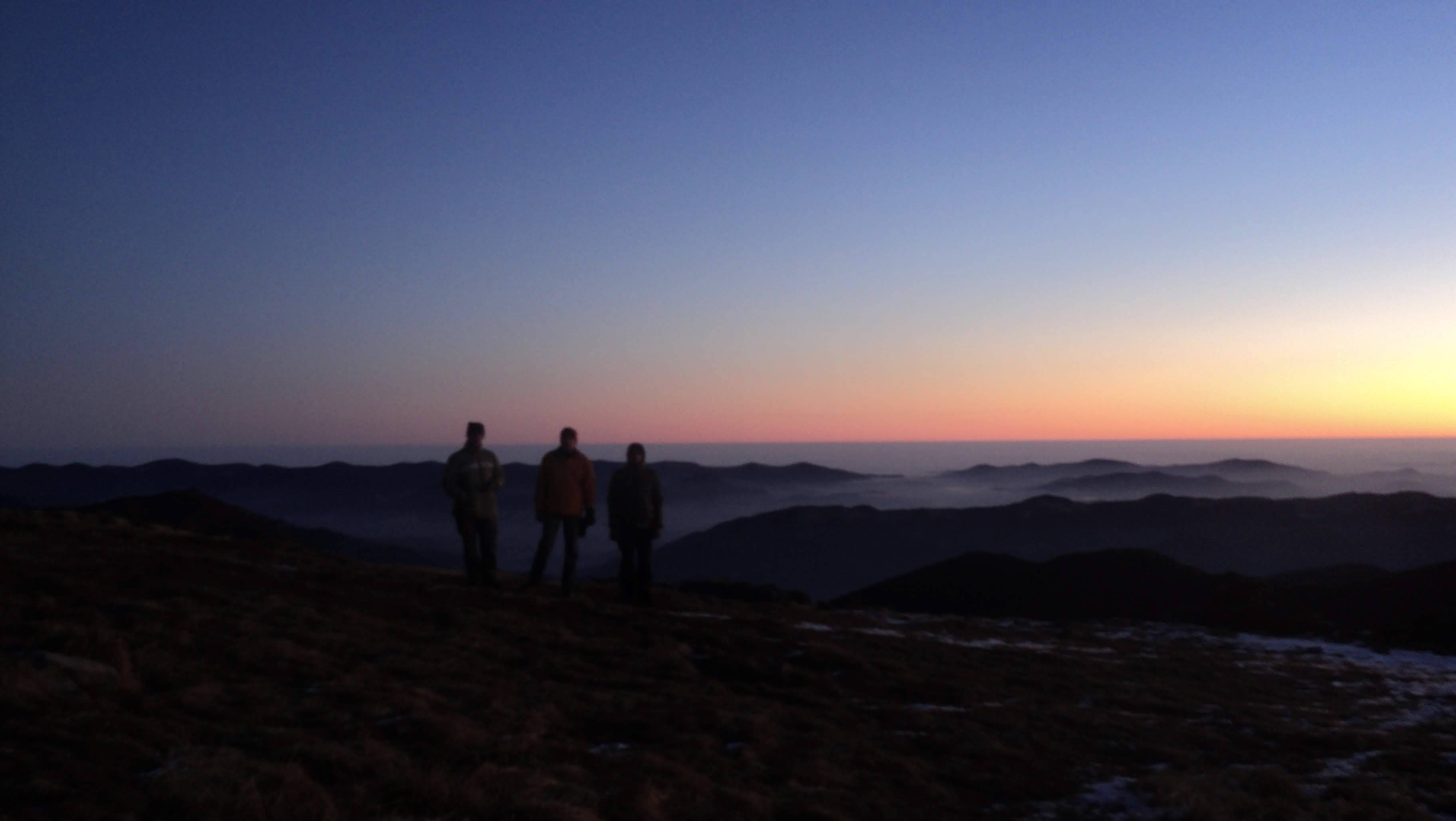 Mountain travelers meet the sunrise