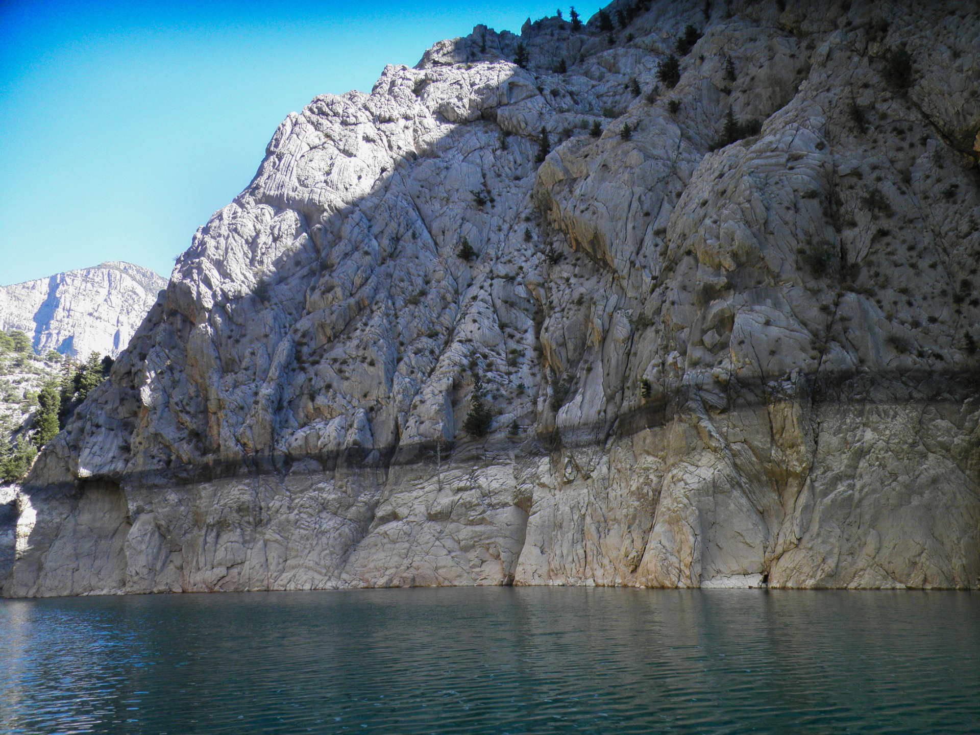 The previous water levels are visible on the rock
