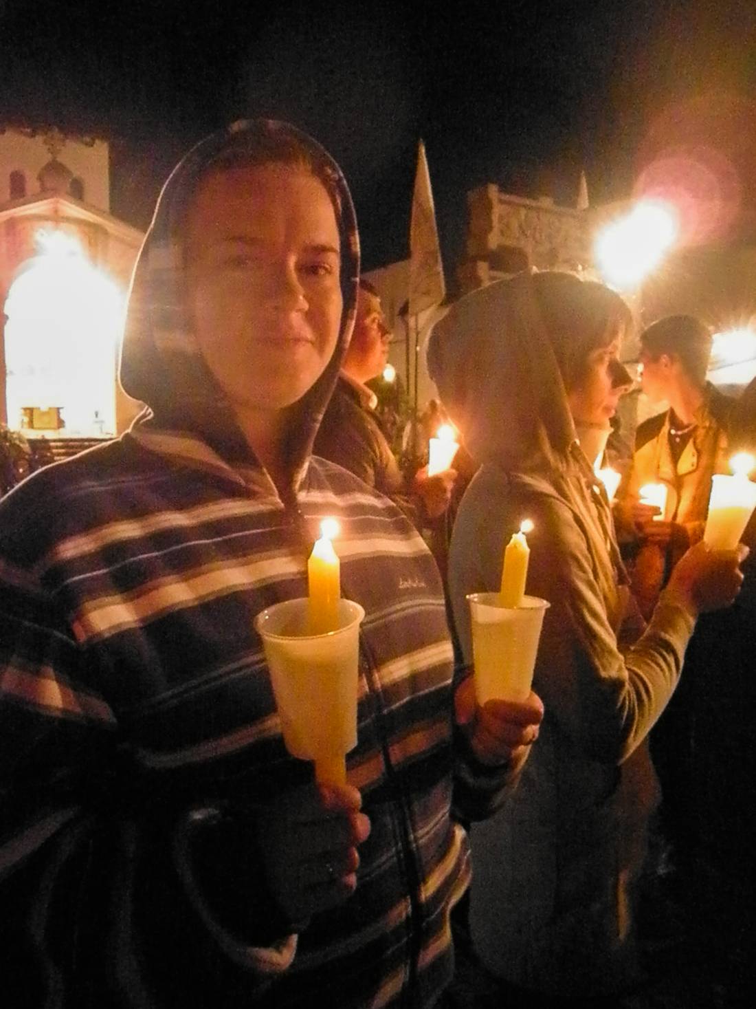 My wife and her friend are holding candles