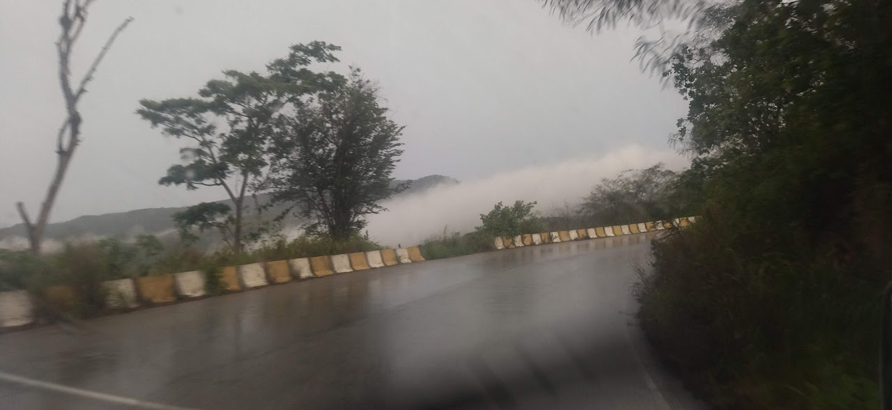 raining in the middle of the road as you can see the clouds road pto la cruz cuamana