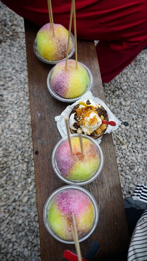 Four ice balls and one coconut ice cream (topped with roasted coconut bits, chocolate shavings and some crunchies, served in a coconut shell!)