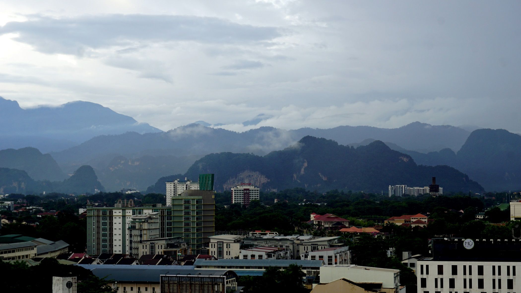 View from the balcony - Layers... of hills, and mountains, of varying shades... coupled with low lying clouds from the rain... all make a pretty picture!