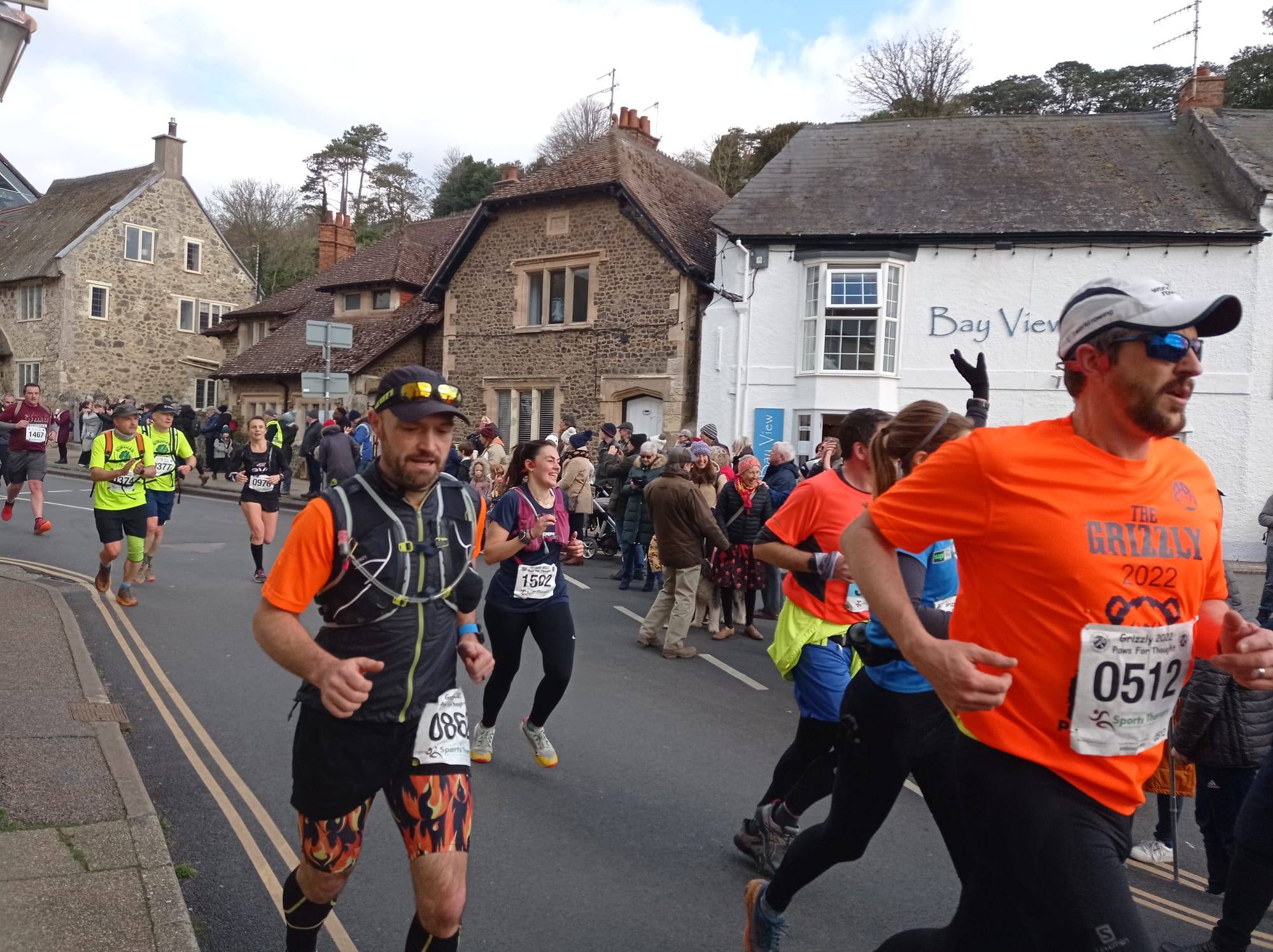 In the village of Beer, the first set of runners storm through