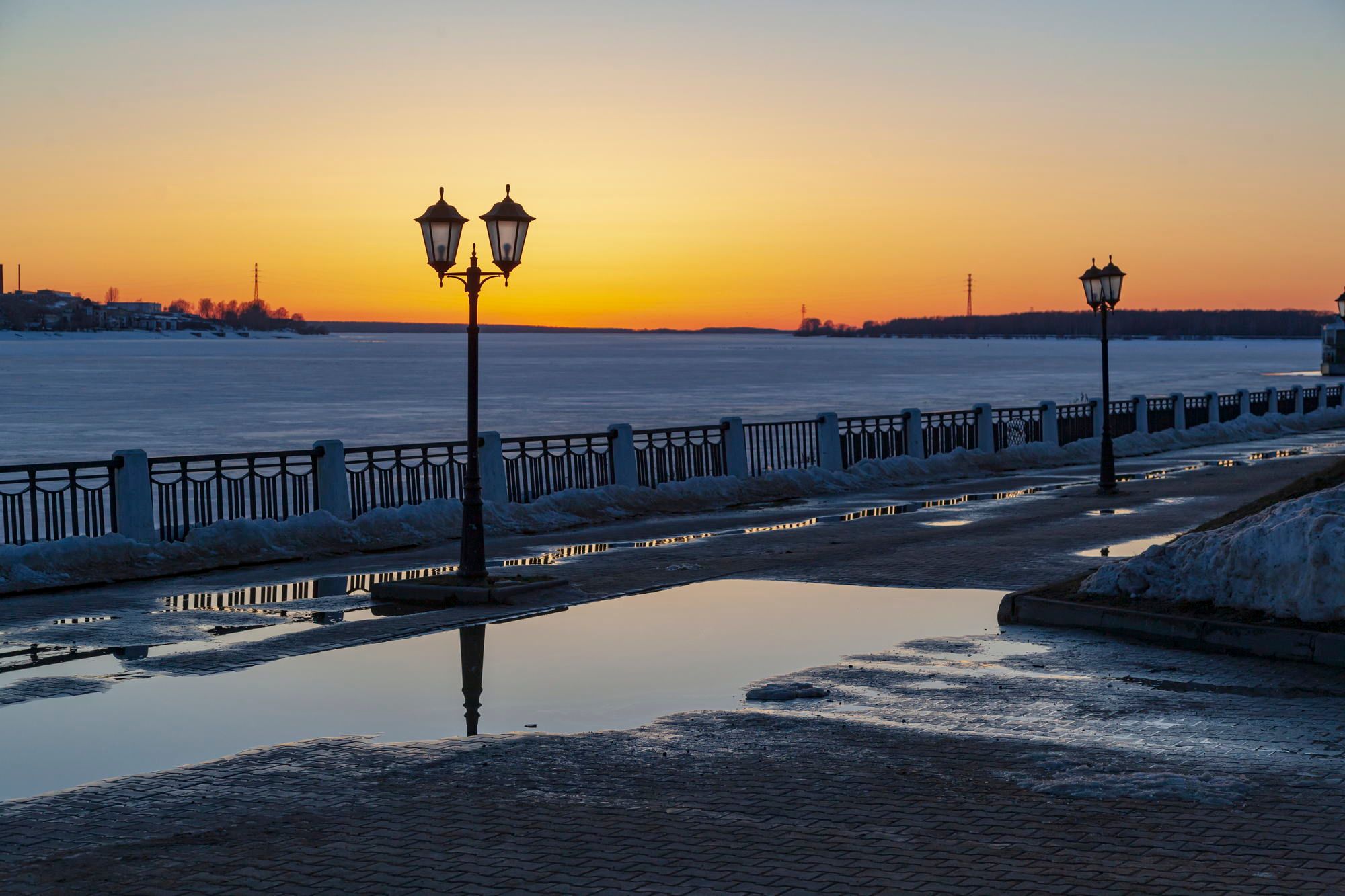 Reflections in puddles at sunset